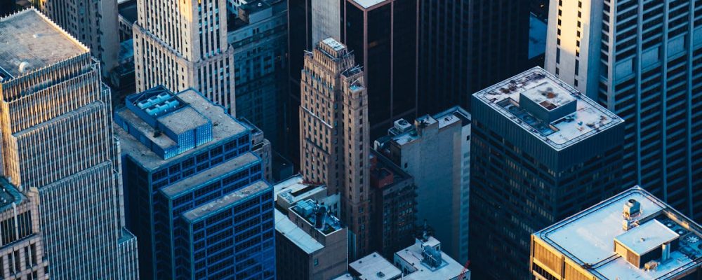 Dramatic aerial view of Chicago's iconic skyscrapers at twilight, showcasing urban architecture.