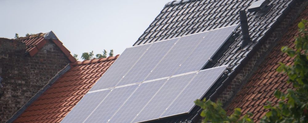 Solar panels installed on a residential rooftop, showcasing eco-friendly renewable energy solutions.