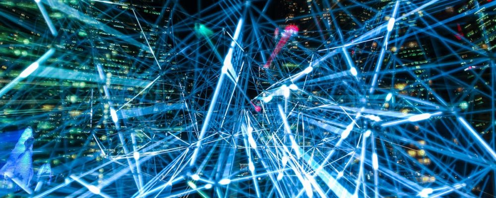 Dynamic urban scene showcasing interconnected light trails representing digital communication networks.